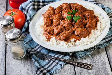 Chicken tikka masala served with rice