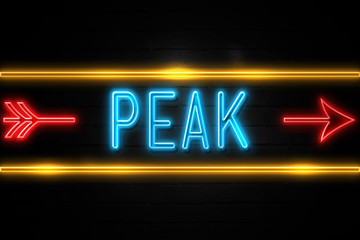 Peak  - fluorescent Neon Sign on brickwall Front view