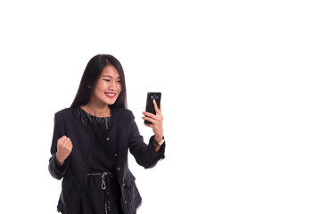 Happy Asian business woman with cellphone, winning and successfull , isolated on white in studio