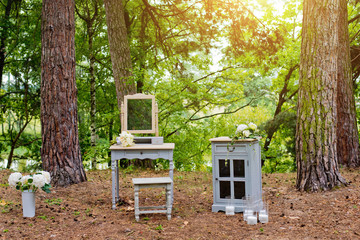 Wedding decorations in rustic style. Wedding at nature in the forest.