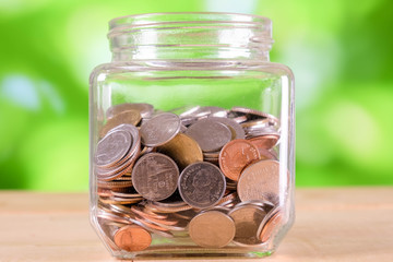 business finance. save money for investment concept money in the glass