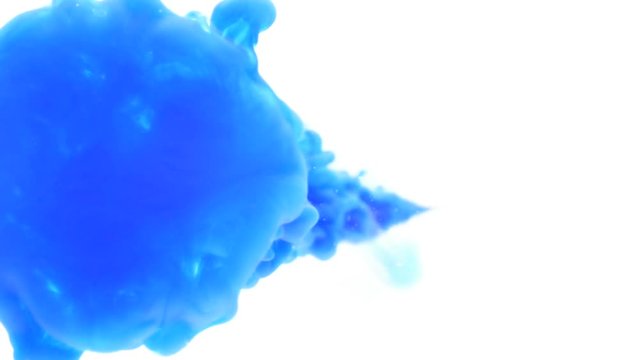Macro of sprayed blue ink paint spilling in water abstract background
