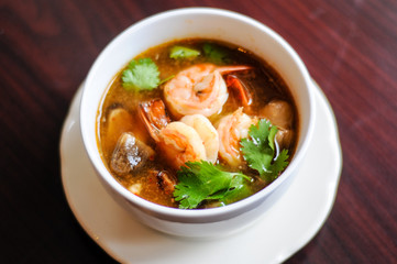 Shrimp Tom Yum, Mushroom, tomatoes, lemongrass, lime leave, galangal in Thai chili sour broth.