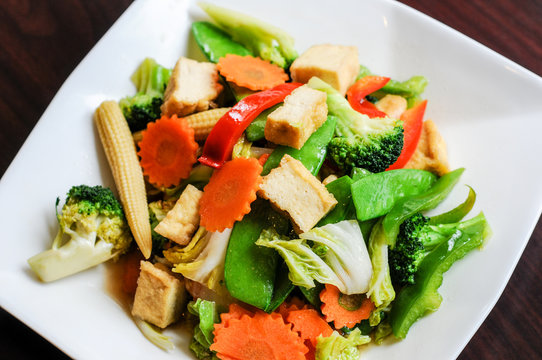 Stir-Fried Mixed Vegetables, Stir-fried broccoli, baby corn, carrots, peapods, napa and bell pepper in a soy sauce.