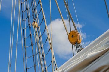 Folded sail and mast on an old sailboat © Igor Sokolov
