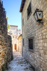 Fototapeta na wymiar The picturesque narrow streets of the old town of Ulcinj in Montenegro 