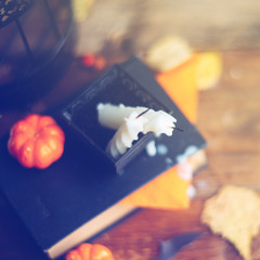 Halloween holiday background with pumpkin and candy. View from above