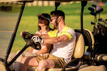 Couple playing golf