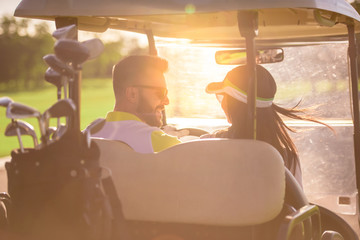 Couple playing golf