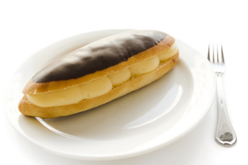 Tasty loaf with cream and chocolate