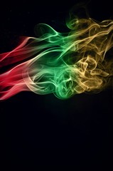 Abstract color smoke on black background, smoke background,red and green and brown ink background, red ,green, brown