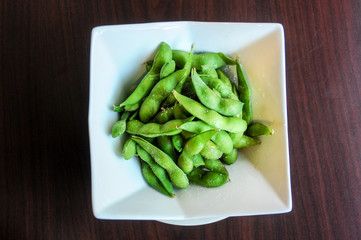 Edamame, A healthy steamed soy bean appetizer.
