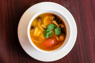 Shrimp Tom Yum, Mushroom, tomatoes, lemongrass, lime leave, galangal in Thai chili sour broth.