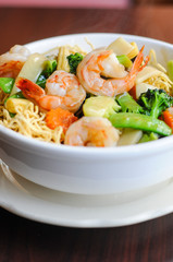 Goey See Me, Crispy egg noodle topped with broccoli, mushroom, bamboo shoot, peapod, carrot, baby corn in delicious gravy sauce