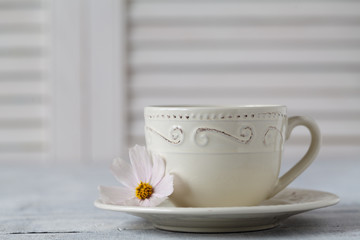 Closeup of cup of tea on wooden table with blur background