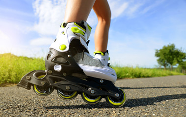 Female legs in inline skates.