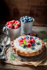 Homemade and rustic tart with mascarpone cheese and fruit