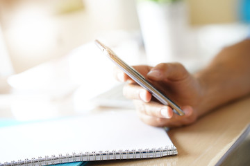 Closeup of male's hands holding smartphone