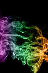 Abstract colorful smoke on black background, color background,colorful ink background,Violet, Green, Orange