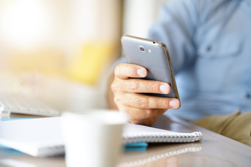 Closeup of male's hands holding smartphone