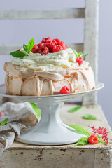Delicious and crispy Pavlova dessert with raspberries and meringue