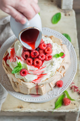 Delicious and crispy Pavlova cake made of mascarpone and berries