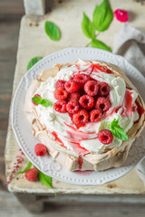 Sweet and creamy Pavlova cake made of mascarpone and berries