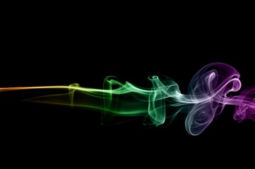 Obraz na płótnie Canvas Abstract colorful smoke on black background, color background,colorful ink background,Violet, Green, Orange