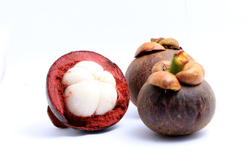 Mangosteen and another cut in half isolated on white background.