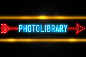 Photolibrary - fluorescent Neon Sign on brickwall Front view