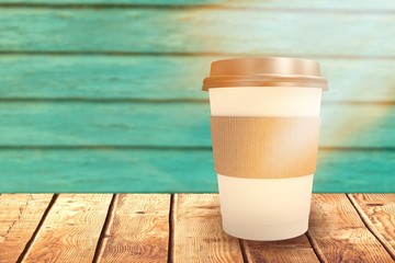 Composite image of white cup over white background
