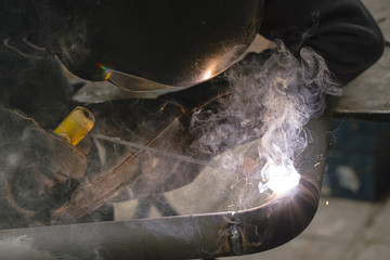Naklejka premium welder welds pipes for gas installation