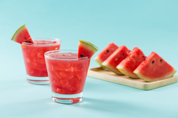 Watermelon drink in glasses with slices of watermelon in summertime