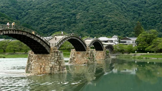 Wooden bridge across river in Japan