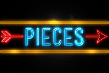 Pieces  - fluorescent Neon Sign on brickwall Front view