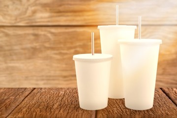 Composite image of white cups over white background