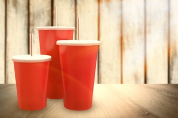 Composite image of red cups over white background