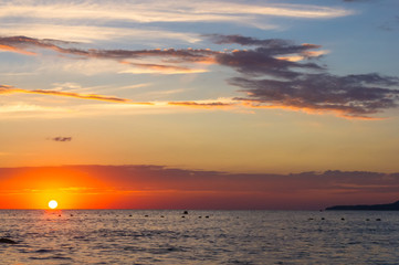 Amazing sea sunset, the sun, waves, clouds