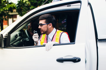 Rescuers radio communication with car.