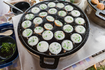khanom krok in pan. Thai sweet dessert made from coconut milk .