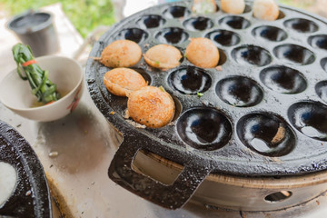 khanom krok in pan. Thai sweet dessert made from coconut milk .