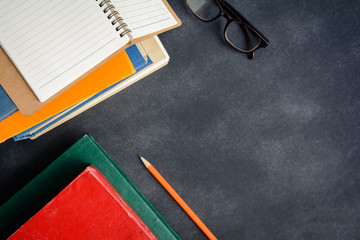 Book glasses and pencil on the desk