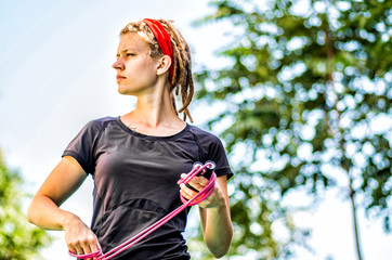 close up of a young sportive woman with a jumprope
