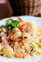 Pineapple Fried Rice, Stir-fried rice with egg, pineapple, raisins, cashew nuts, green onions and tomatoes.