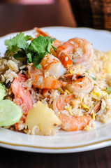 Pineapple Fried Rice, Stir-fried rice with egg, pineapple, raisins, cashew nuts, green onions and tomatoes.