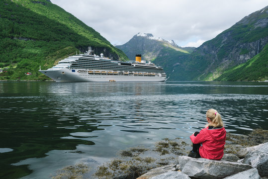 Girl on the shore of the Geiranger fjord