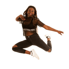 Active young woman dancer jumps in the air isolated over white background