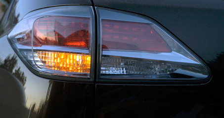 Taillight at the car at evening. Modern car interior
