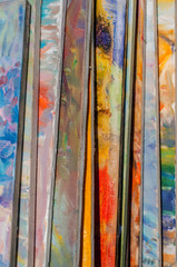 Paintings painted in oil piled up in a pile