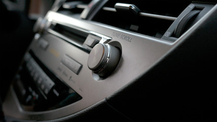 Fototapeta na wymiar Car volume audio control, Transportation and vehicle concept - car audio stereo 